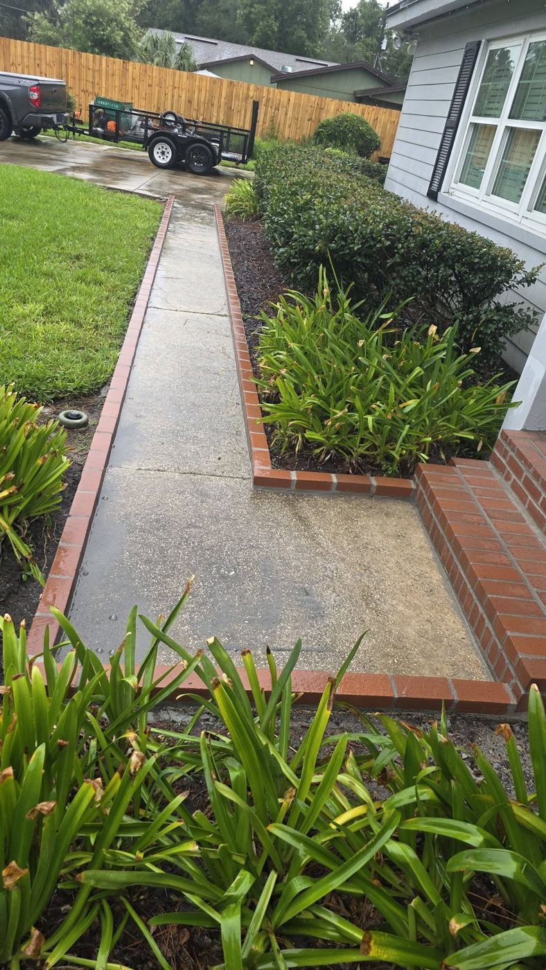 Brick-bordered walkway by Island Times Masonry