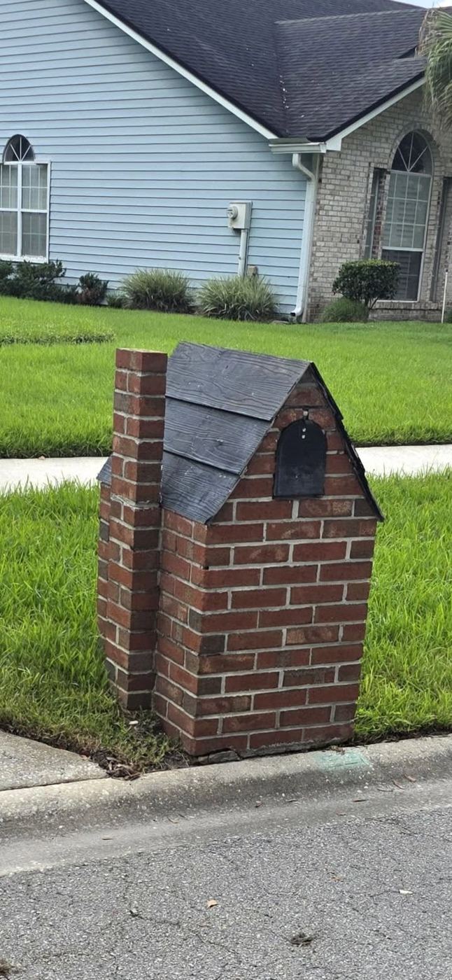 Brick mailbox with roof by Island Times Masonry