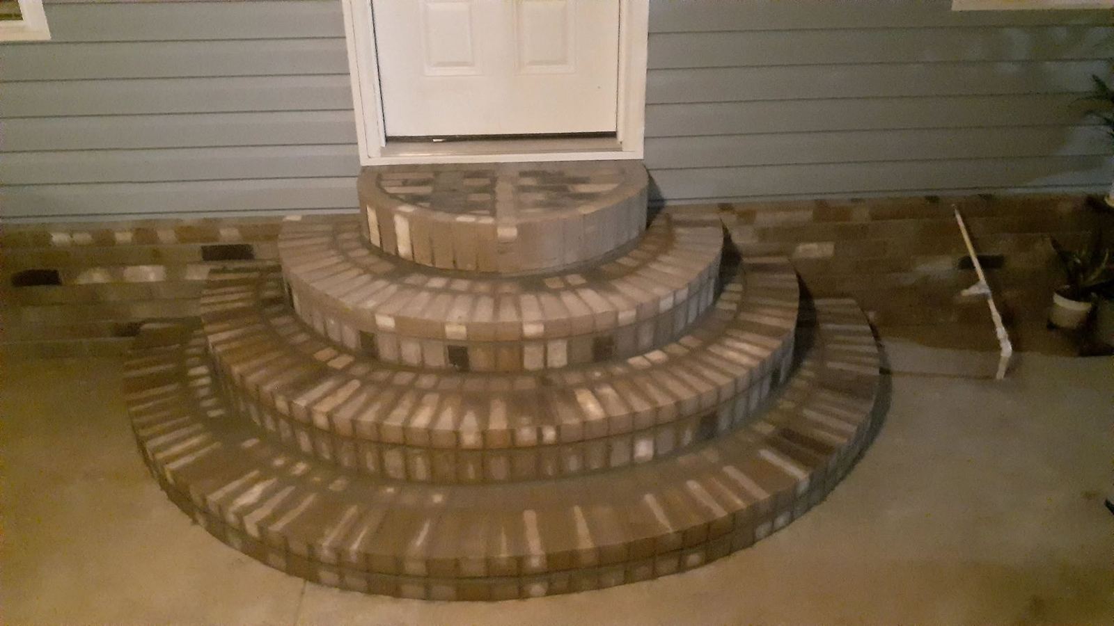 Curved brick entry steps built by Island Times Masonry